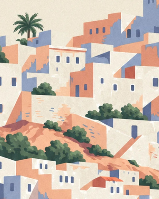 The casbah's white and ochre houses cascading down the hillside among green shrubs