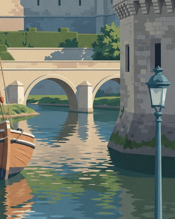 Le pont de pierre à 2 arches, la tour du château et son lampadaire bleu, au bord de l'eau