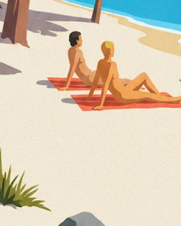 A couple lying on 2 red towels in the sunshine on the pale sand