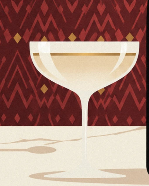 The champagne coupe with its slender stem on a cream marble table