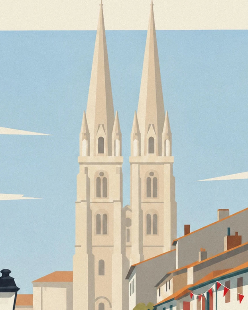 The 2 slender spires of the cathedral in Bayonne above the orange rooftops