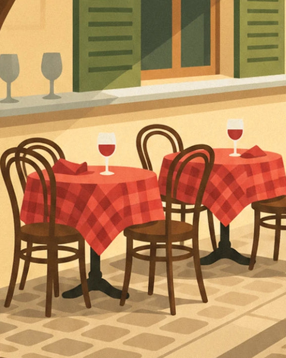 The tables with red checked tablecloths and wooden bistro chairs, with a glass of red wine