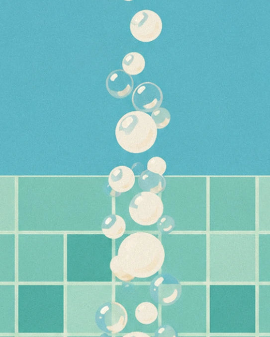 Des bulles de savon qui s'envolent devant le carrelage vert d'eau et le mur bleu