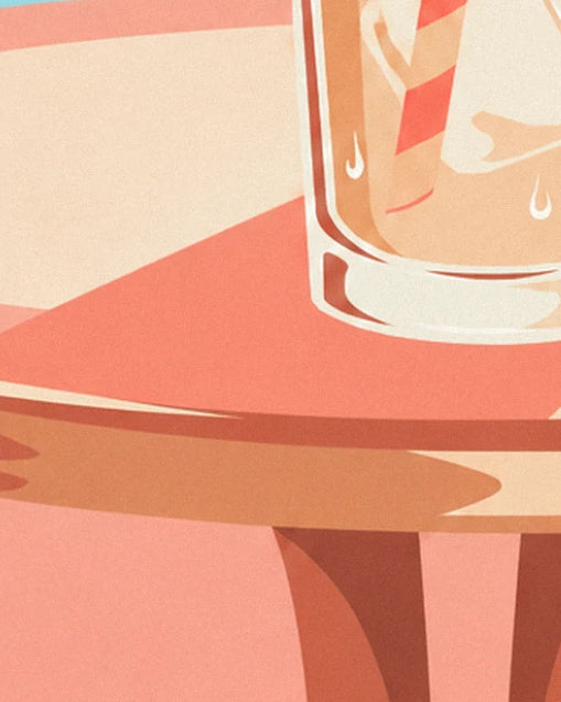 The foot of the glass and reflections of iced coffee on the pink table, with its cast shadow