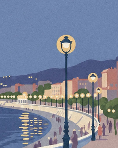 The promenade lined with glowing street lamps, with people strolling by the water