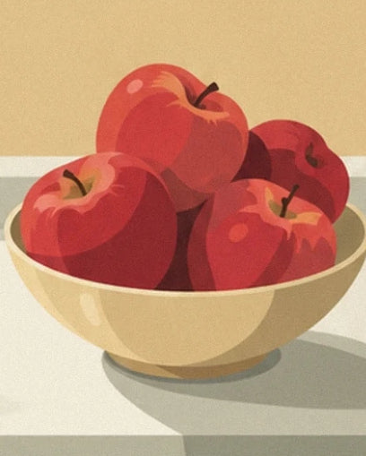 Les pommes rouges aux reflets dorés dans une coupe couleur crème