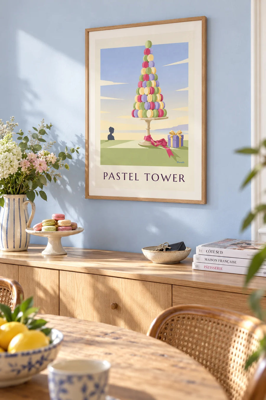 Poster of a pyramid of colorful macarons in a pastry shop: framed on a wall