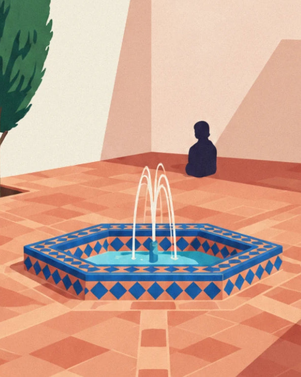 La fontaine hexagonale en faïence bleue et ses 3 jets d'eau, sur le dallage de terre cuite