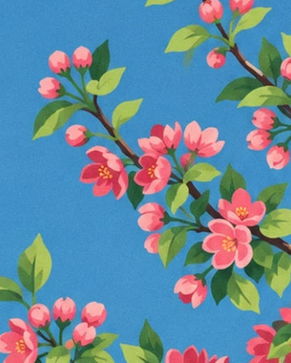Pink apple blossom and buds on leafy branches against a blue background