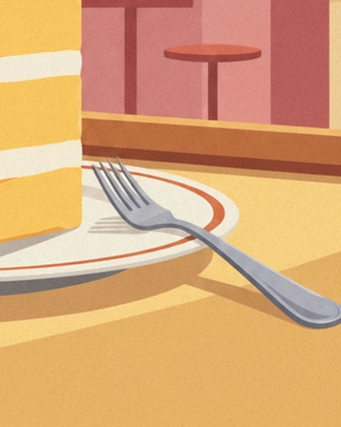 A silver fork on a red-rimmed plate at the foot of the millefeuille