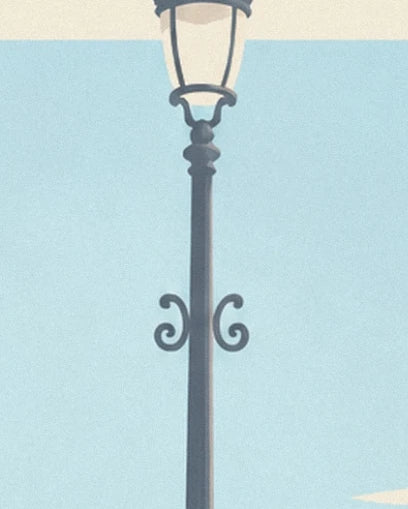 The dark park lamp with decorative scrollwork against a pale blue background