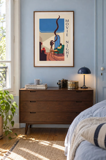 Movie night at home with a camera and unrolled film strip poster: framed on the wall