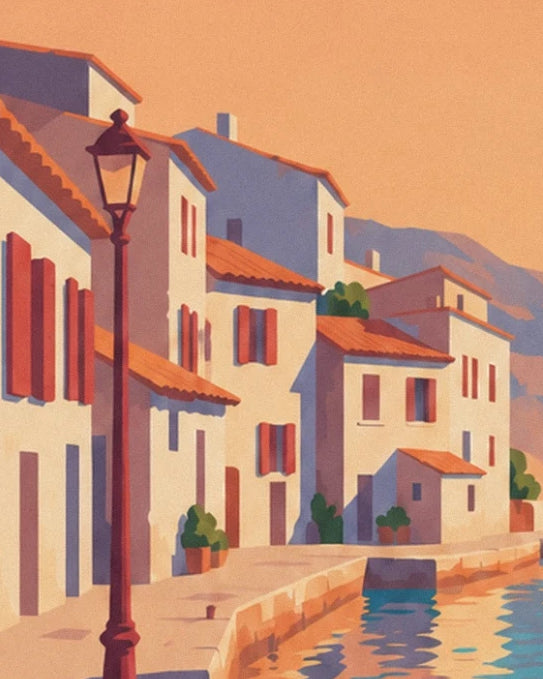 Les maisons claires aux volets rouges et le réverbère au bord du quai