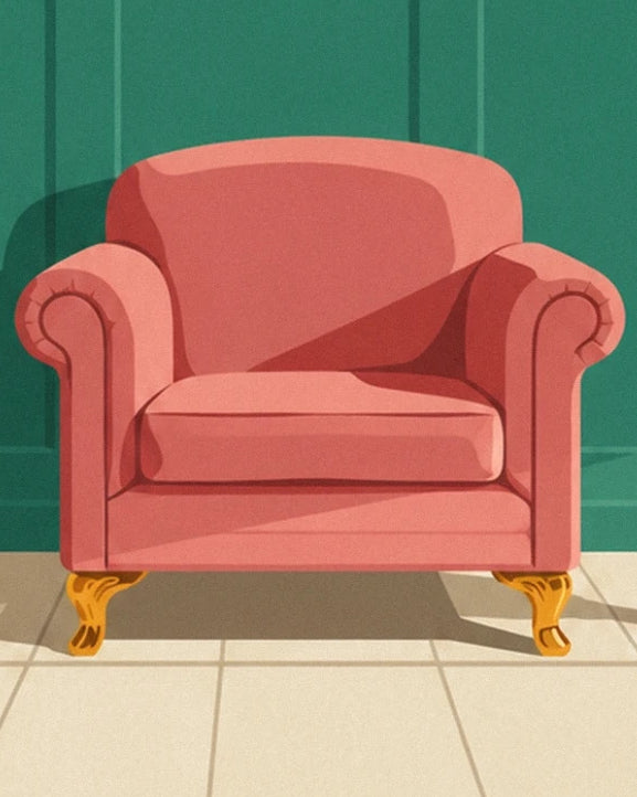 Un fauteuil rose corail aux accoudoirs arrondis et aux pieds dorés, sur un sol carrelé