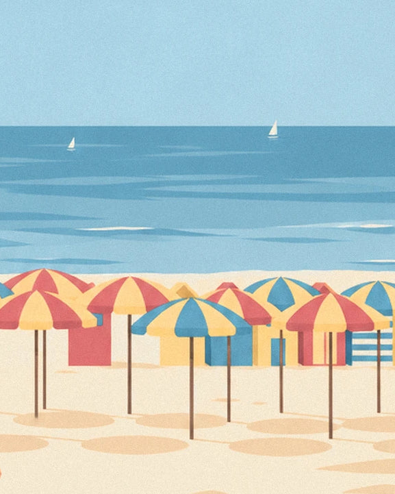 Red, yellow and blue parasols in front of the beach huts, facing the sea and 2 sailing boats