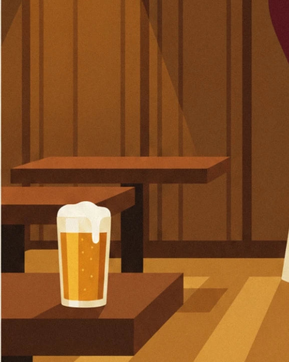 Une chope de bière blonde posée sur une table de bois, au parquet clair