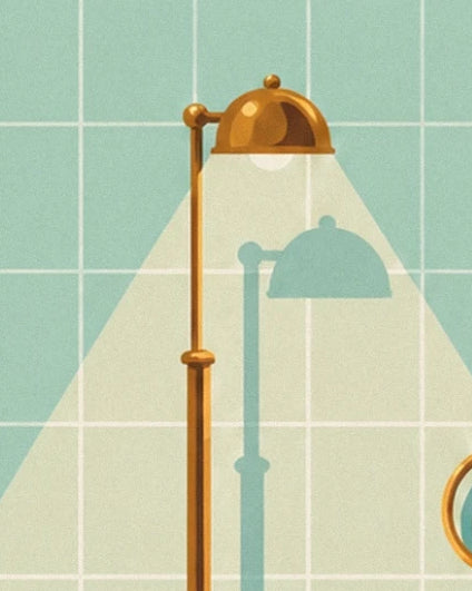 The golden lamp and its bright beam on the green bathroom tiles