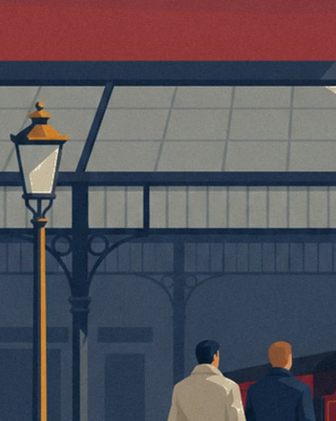 The golden street lamp and 2 travellers seen from behind beneath the station's metal framework