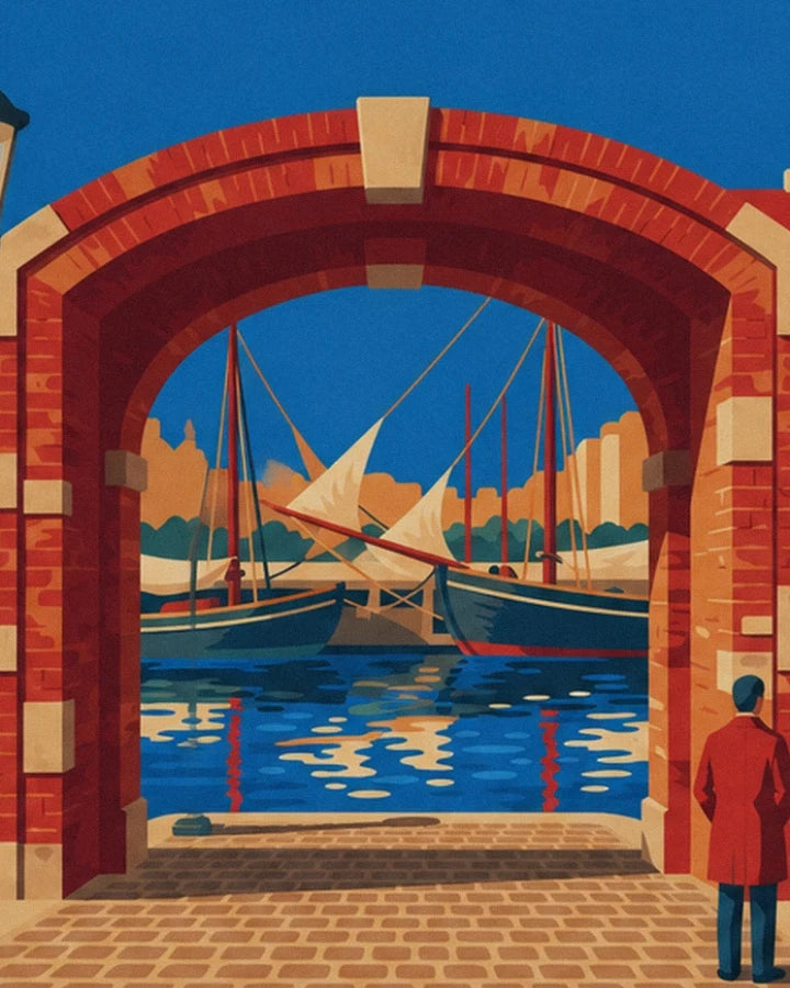 Les vieux voiliers sous une arche de briques rouges, avec leurs reflets sur l’eau