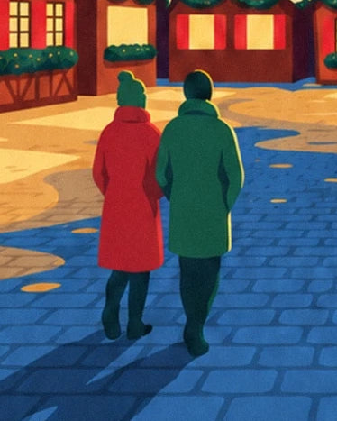 The 2 walkers in red and green coats on the blue-tinted cobbles of the Christmas market