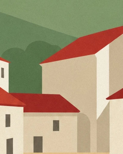 Houses with cream façades and red roofs, in front of the green hills of the Pays basque