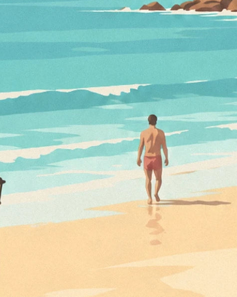 Un baigneur de dos en short rouge face aux vagues, les pieds sur le sable mouillé
