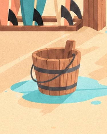 A wooden bucket with dark metal bands in a puddle at the foot of the surfboards