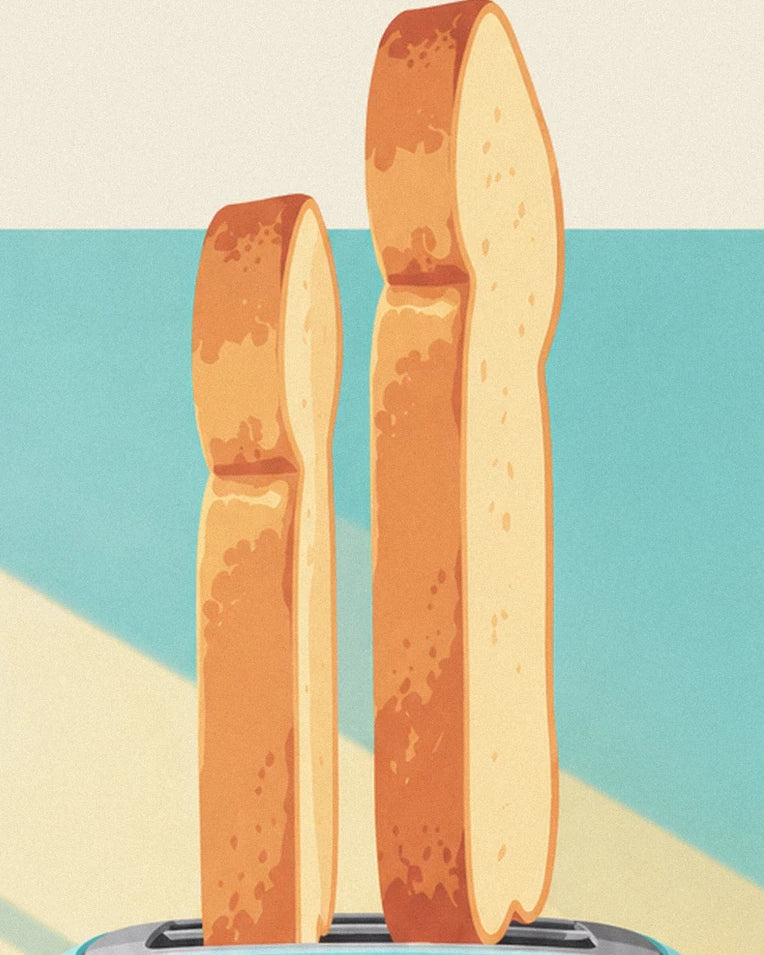 Les 2 tartines à la croûte dorée dressées dans les fentes du grille-pain