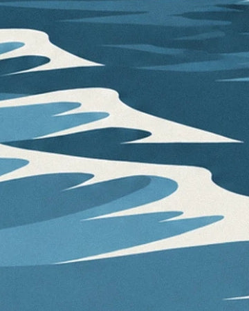The curves of white foam on the water, between deep blue and turquoise reflections