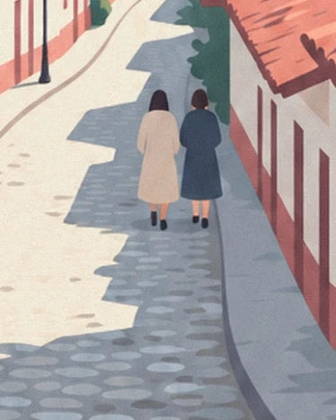 The 2 women in beige and blue coats walking along a cobbled street in La Candelaria