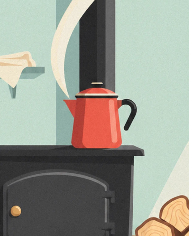 La cafetière émaillée rouge qui fume sur le poêle noir à bois