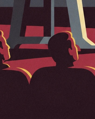 The dark silhouettes of spectators in front of the projector’s grey legs