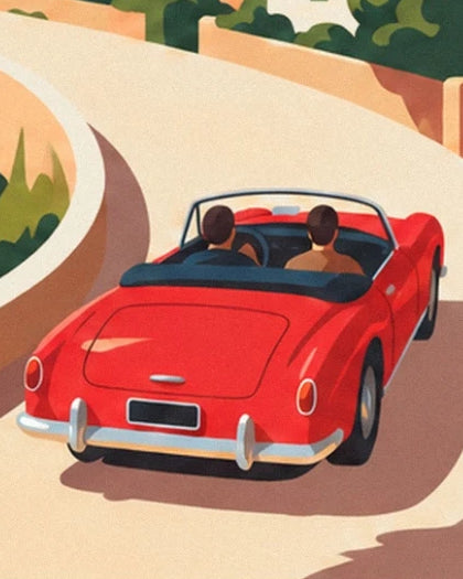 The red convertible and its 2 passengers on the winding coastal road