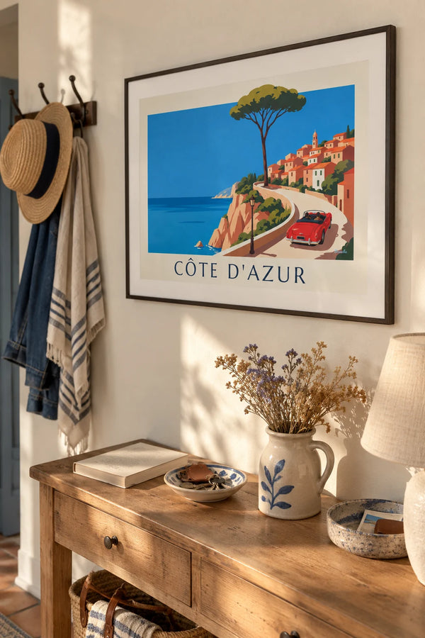 Red convertible on a French Riviera coast road poster