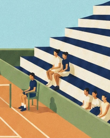 Spectators in the white and navy blue stands beside the court