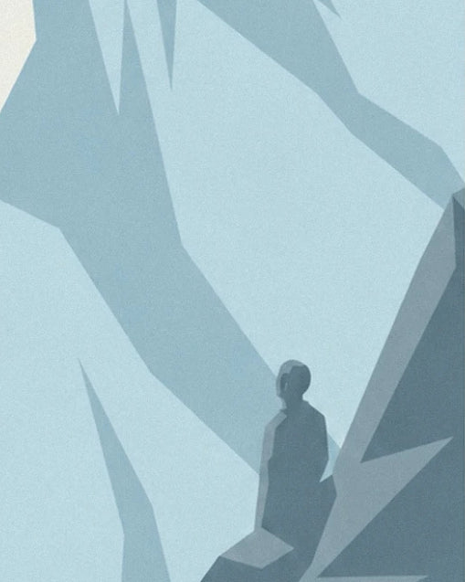 A dark silhouette on a rocky spur among blue-tinged rock faces