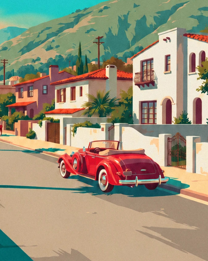 The red convertible with white sides in front of white villas with tiled roofs