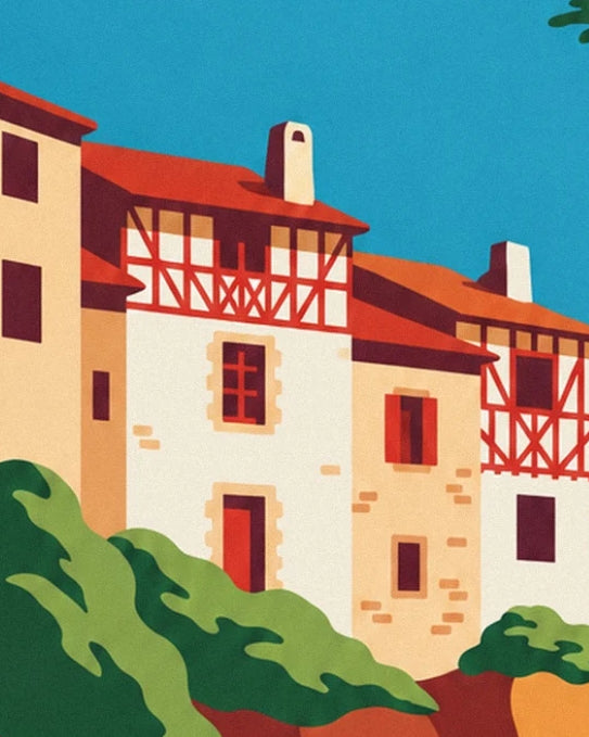 Basque houses with red timber frames and burgundy shutters above the foliage