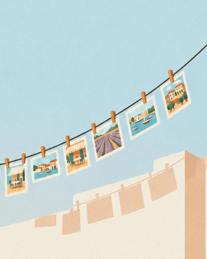 A washing line with wooden pegs and 6 small photos of villages, lavender and a harbour beneath a blue sky