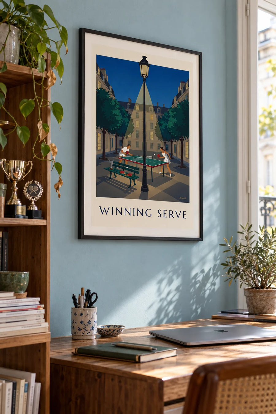 Poster of a nighttime ping-pong game on a Paris square: framed on the wall