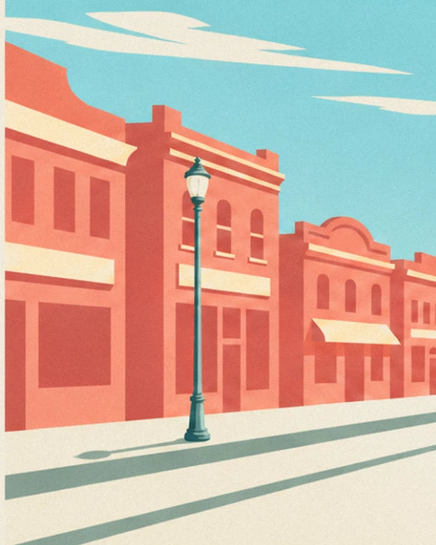 The green street lamp in front of the street's pink façades, beneath a turquoise sky