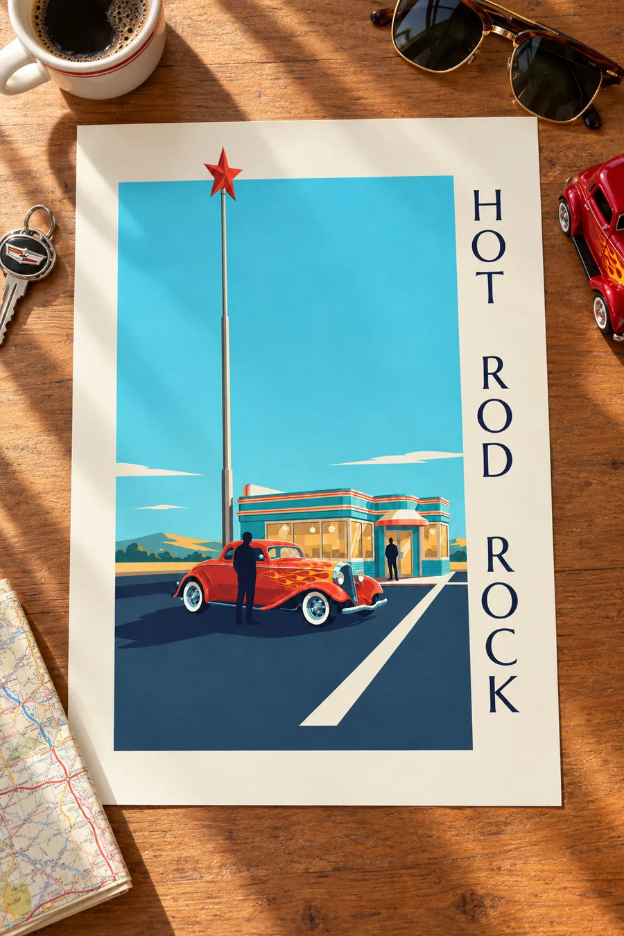 Poster of a hot rod car in front of a rock and roll diner: resting on a table