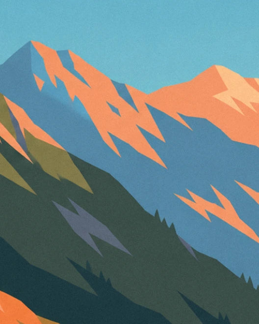 The blue-tinted peaks with orange ridges beneath a turquoise sky, at the far end of the valley