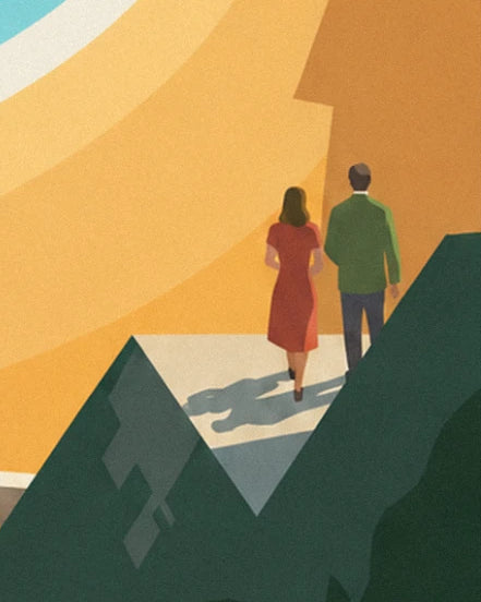 Le couple vu de dos, elle en robe rouge et lui en veste verte, qui marche entre les rochers sombres