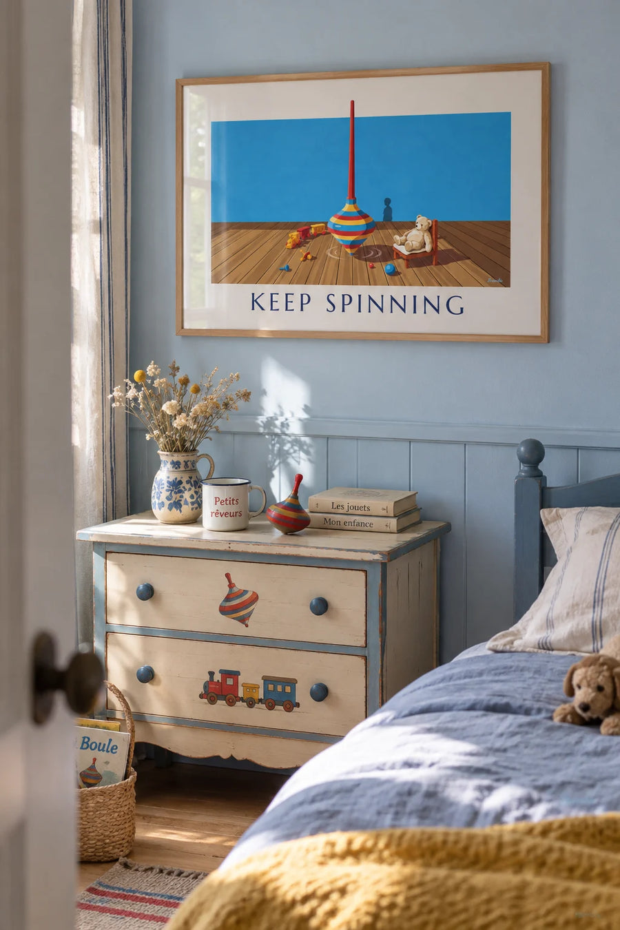 Poster of a red, yellow and blue metal spinning top in a playroom: framed on the wall