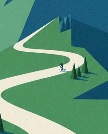 The winding pale road, the small cyclist and the fir trees on the green slopes