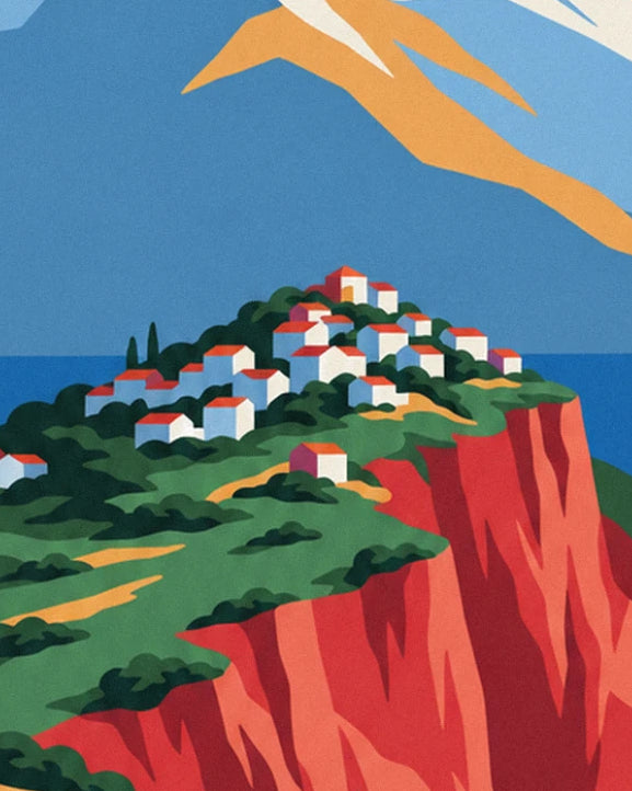 The red-roofed village perched on the red rock cliff above the sea