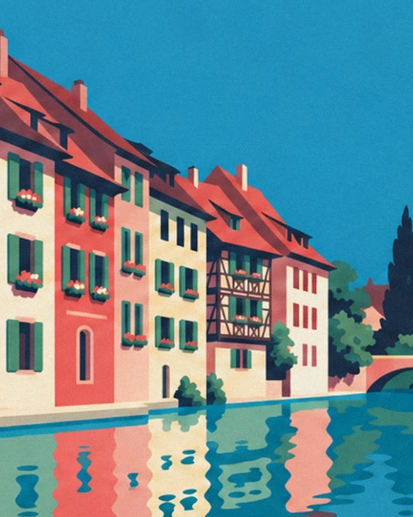 The colourful houses of Colmar and their rippling reflections in the canal