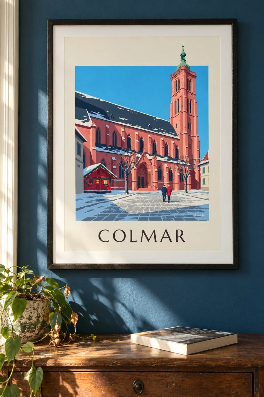 Plakat kolegiaty św. Marcina w Colmarze zimą : w ramie na ścianie