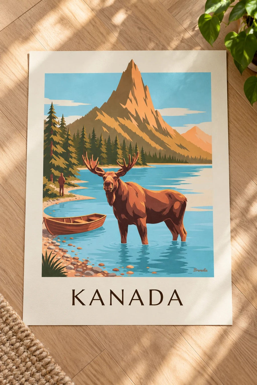 Plakat łoś w jeziorze u stóp gór Kanady: na stole